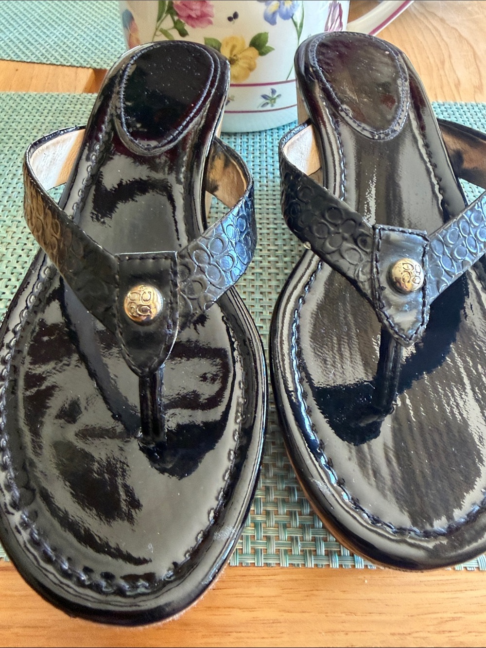 COACH Embossed Black Patent Leather Thong Sandals with Gold Button Accent